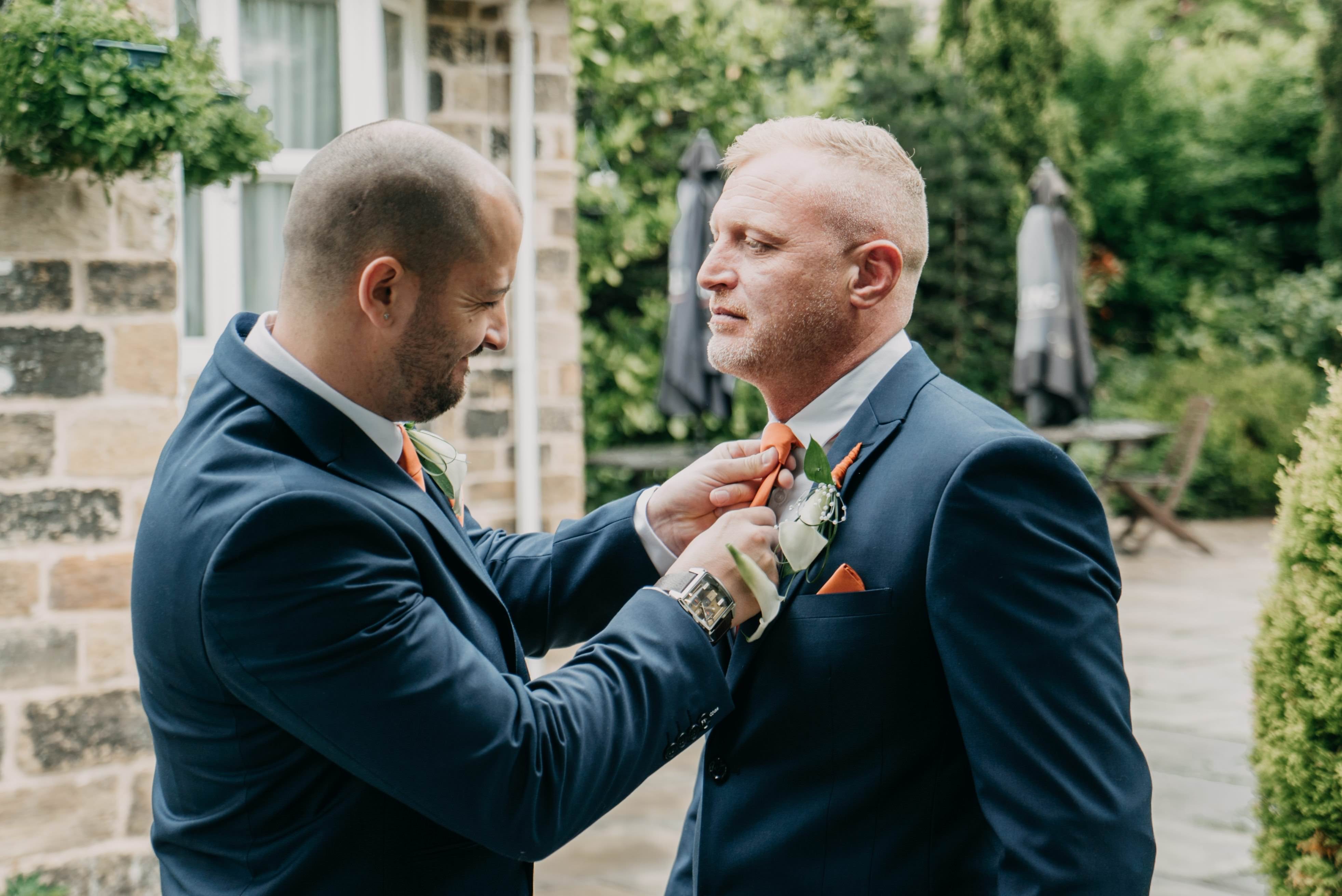 best man checking groom