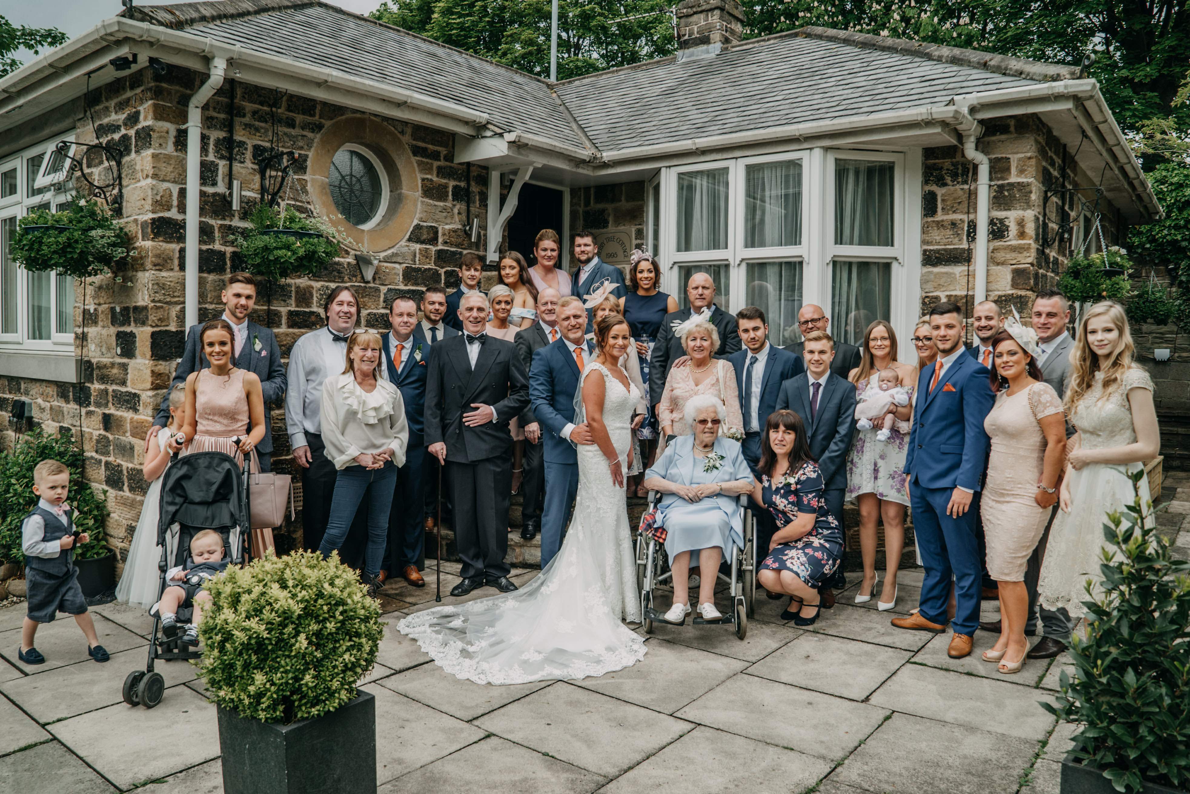 Dimplewell Lodge Group Shot Outside Cottage