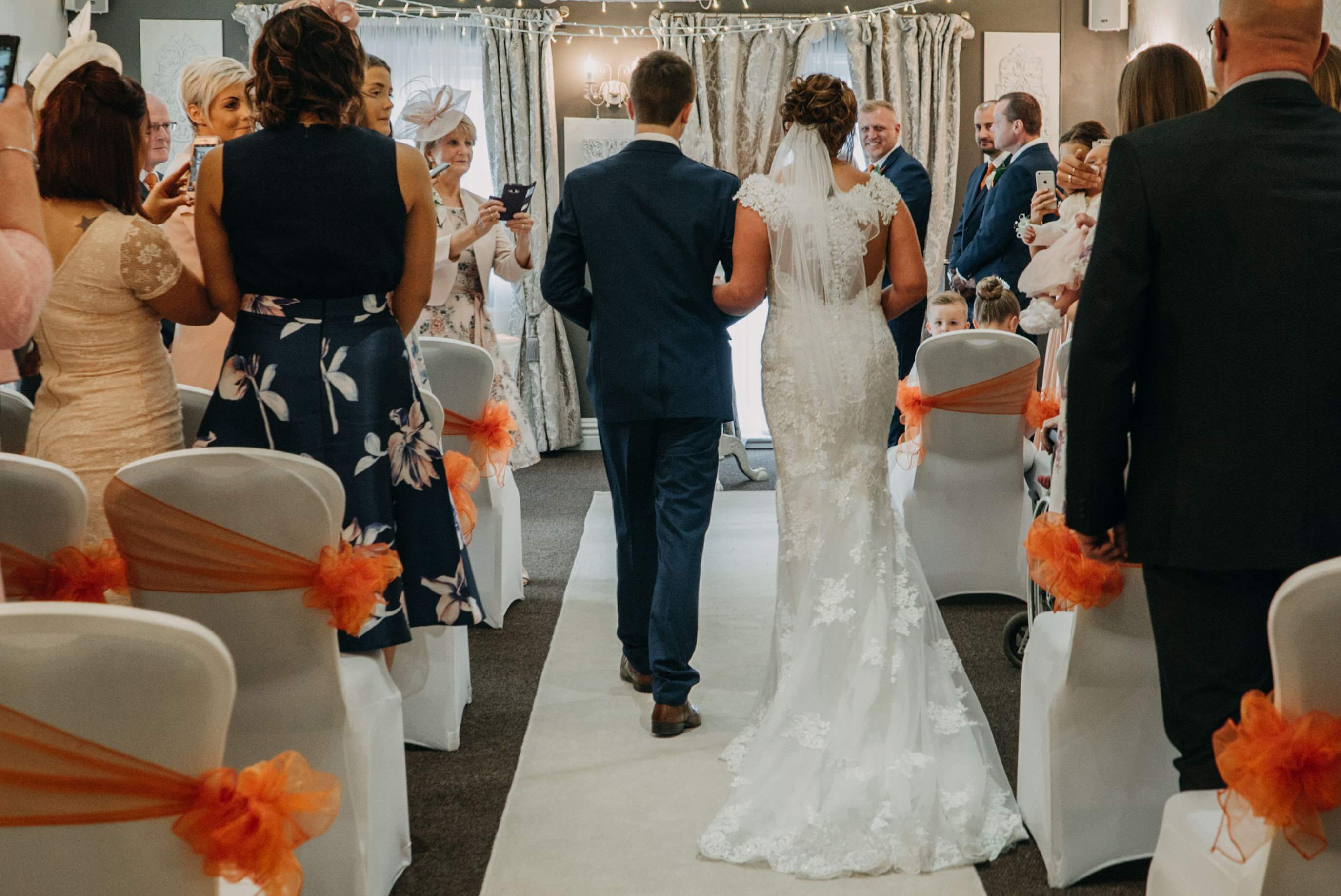 bride walking down isle at dimple well