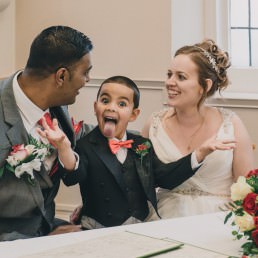 son dressed in groomsman attire
