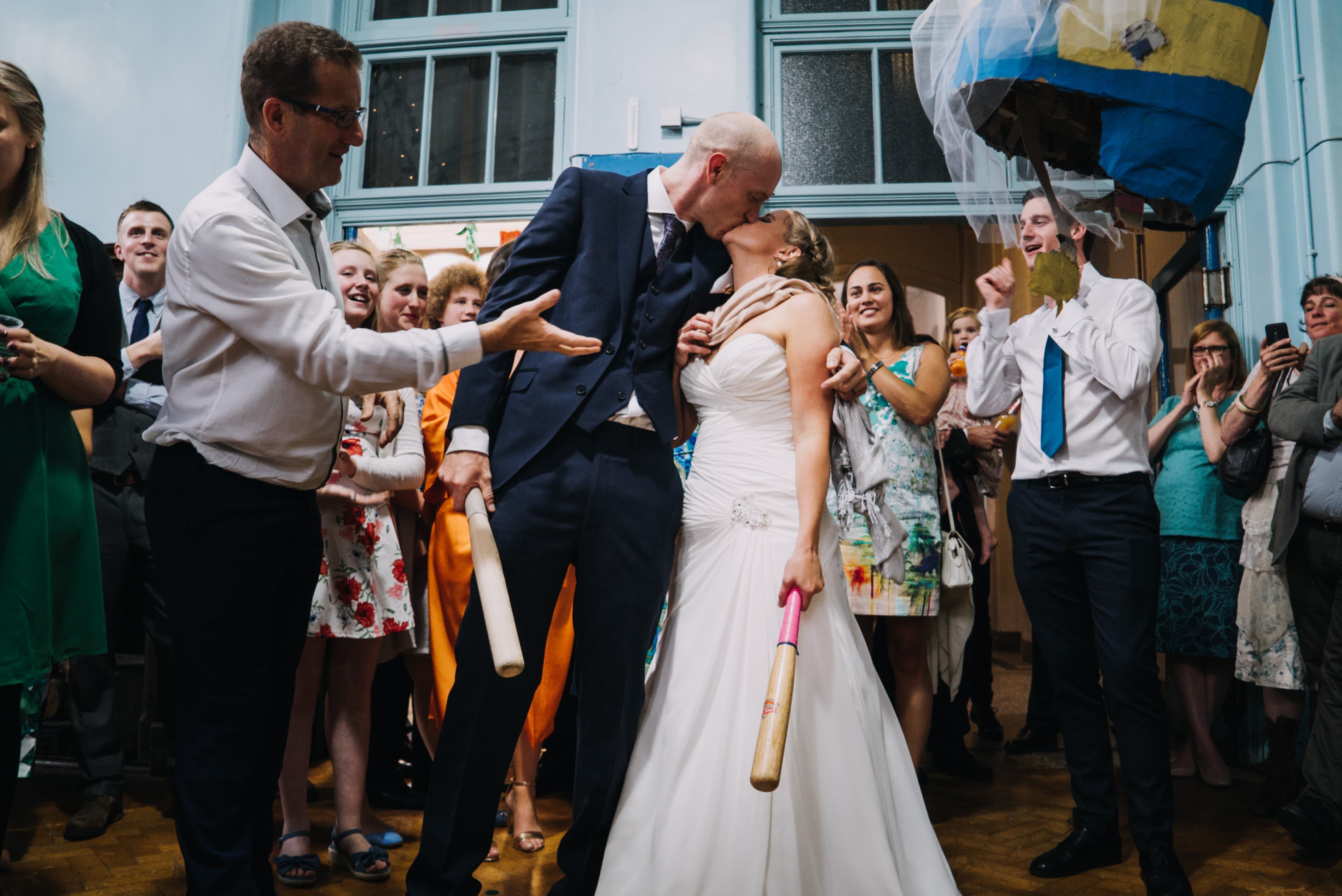 Bride & Groom Kissing after Killing Minon Pinata