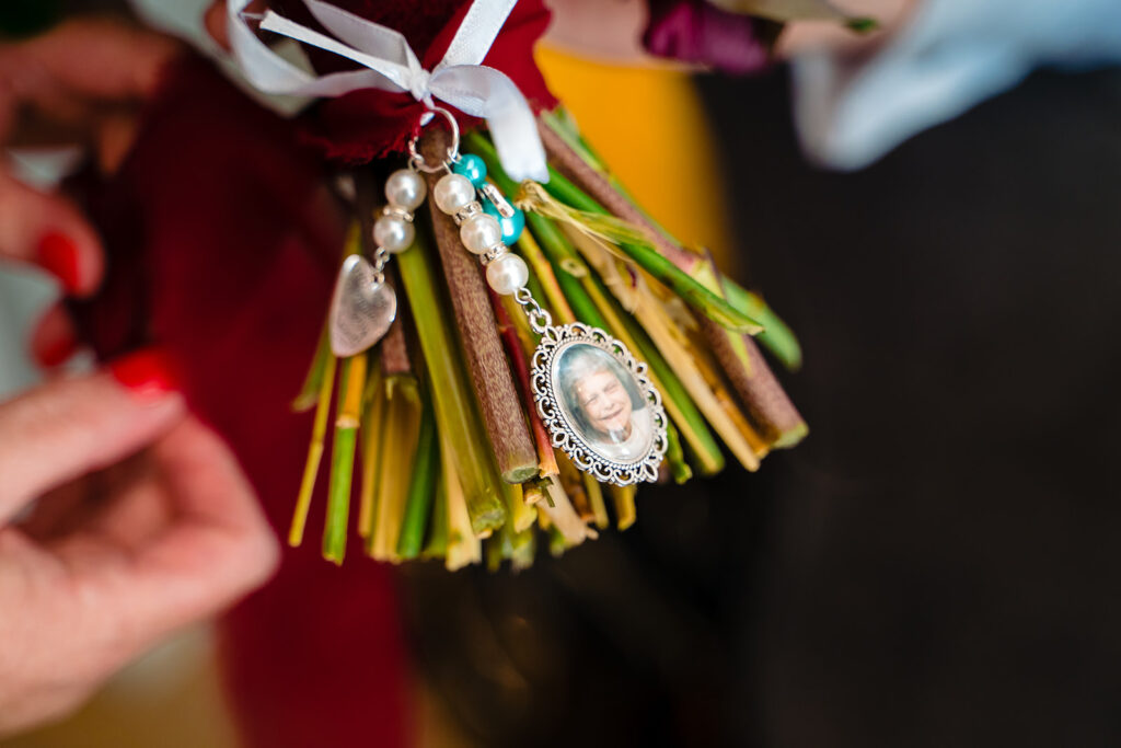 Memorial charm with photo pendant on dried flower bouquet