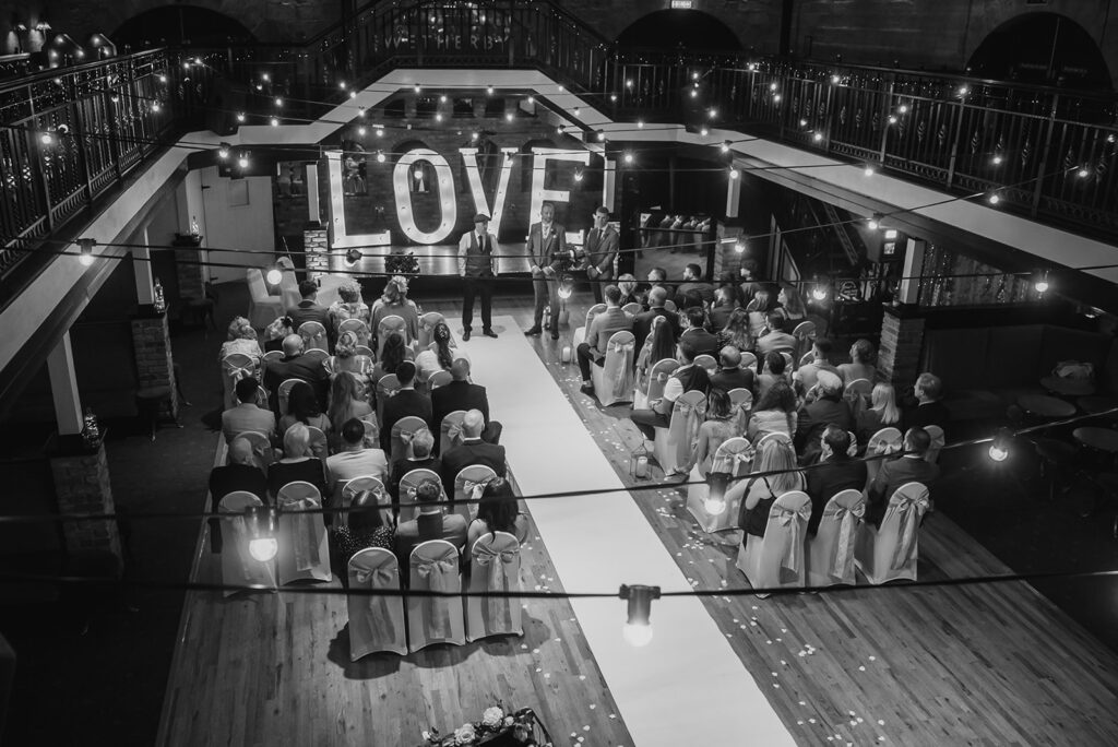Aerial view of elegant wedding ceremony with LOVE sign