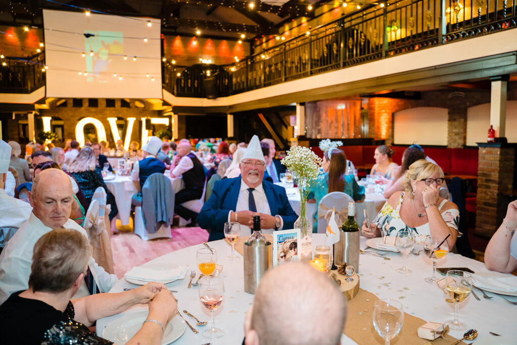 Elegant formal wedding reception with guests dining and celebration