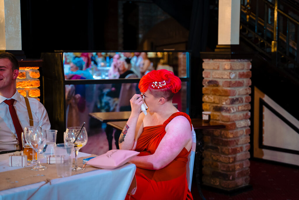 Woman in red dress and matching hair at formal event