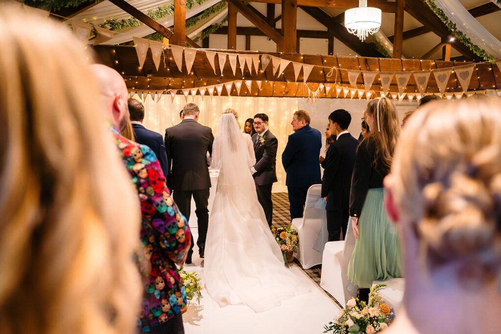 ody's long veil trailing down the aisle as she reaches the front
