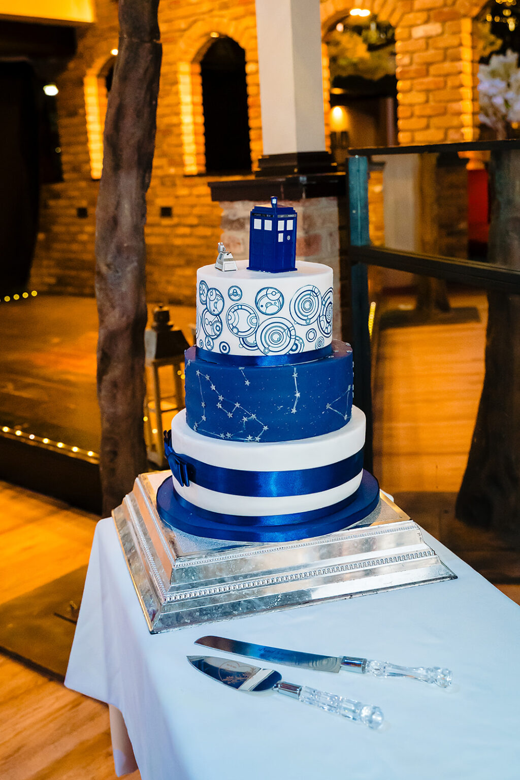Doctor Who themed wedding cake with TARDIS topper