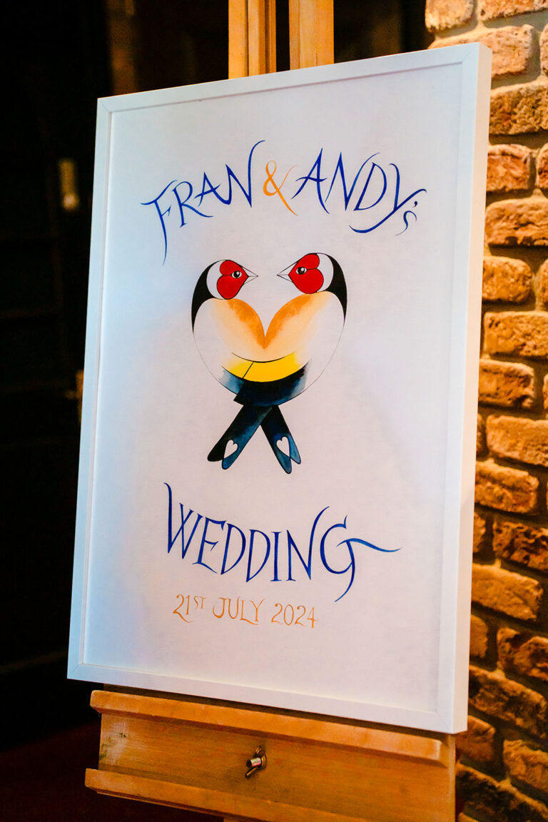Hand-painted Fran and Andy wedding welcome sign with two goldfinches at the Engine Shed, Wetherby