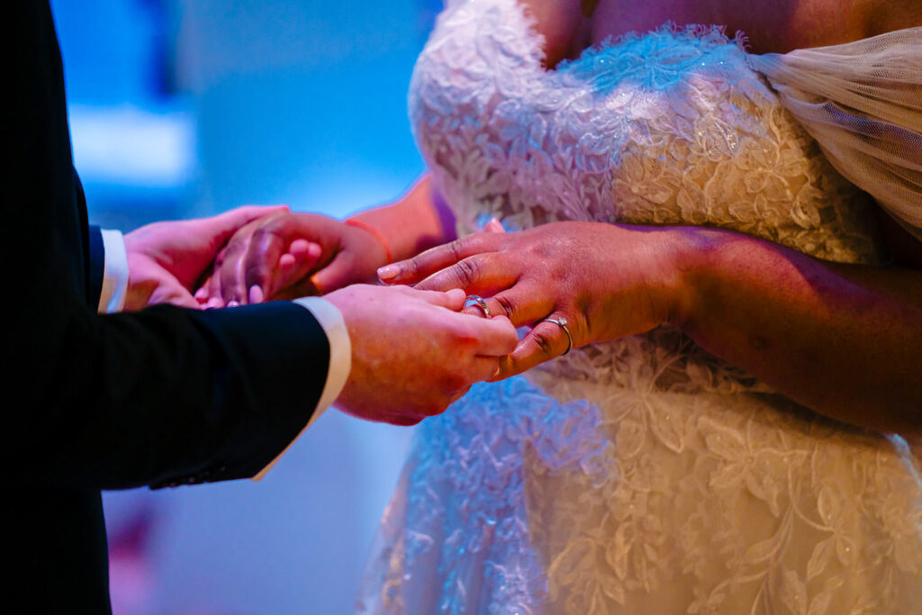 Andy placing the wedding ring on Fran's finger during their Engine Shed ceremony
