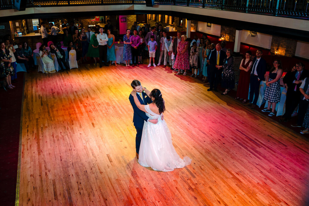 Fran and Andy's first dance to Biffy Clyro on the coloured dance floor, photographed from above