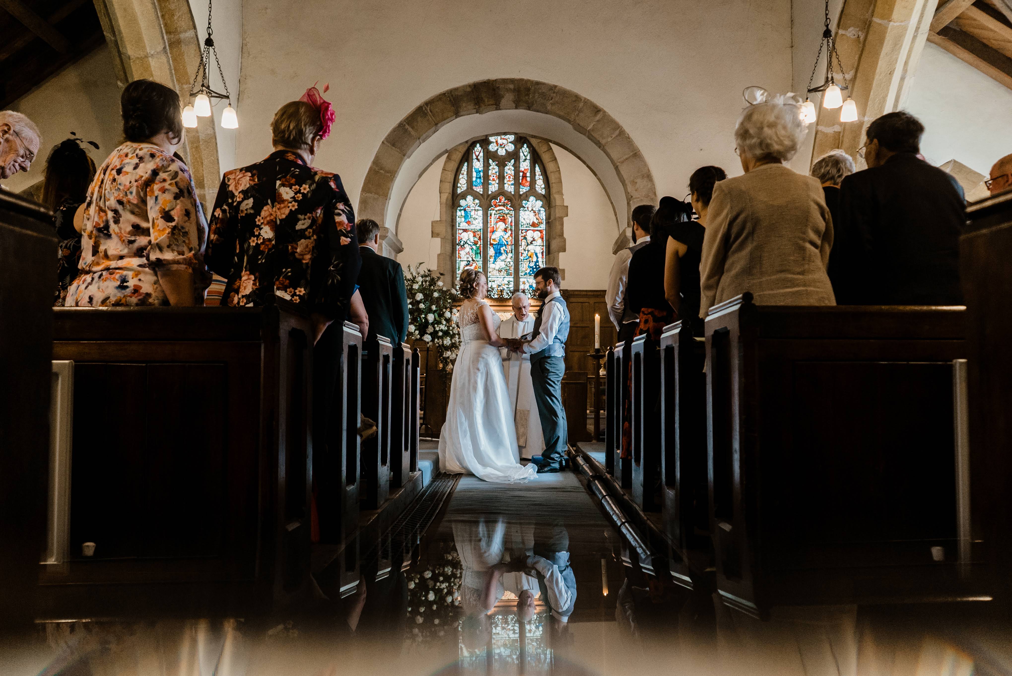 Wedding taking place, reflection at bottom