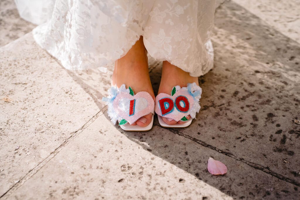 Bride's shoes with "I Do" decoration outside Leeds Civic Hall