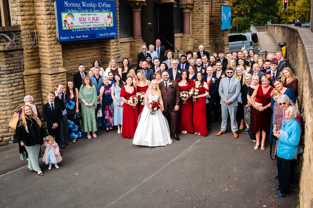 All of Rebecca and Nicholas's wedding guests outside Dewsbury Baptist Church
