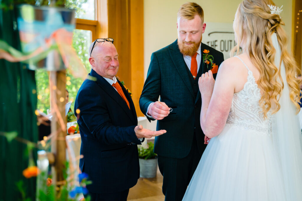 Wedding ceremony with groom exchanging rings
