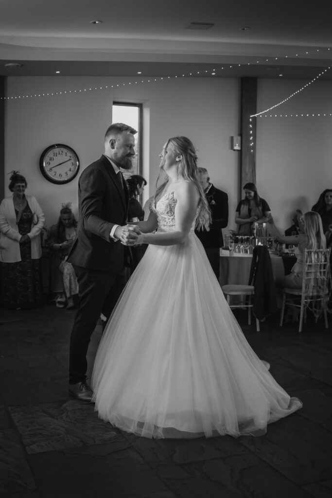 Bride and groom dancing at their wedding at The Out Barn.