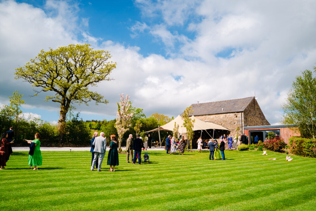 Outdoor wedding reception at The Out Barn rustic barn venue