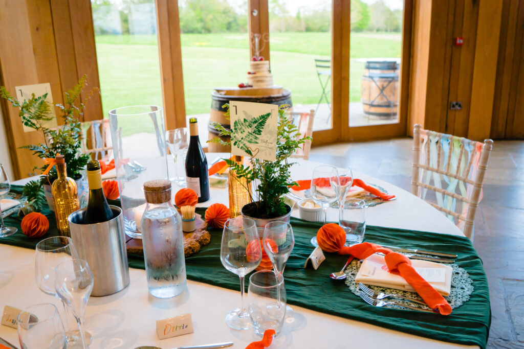 Elegant table setting for a wedding reception at The Out Barn.
