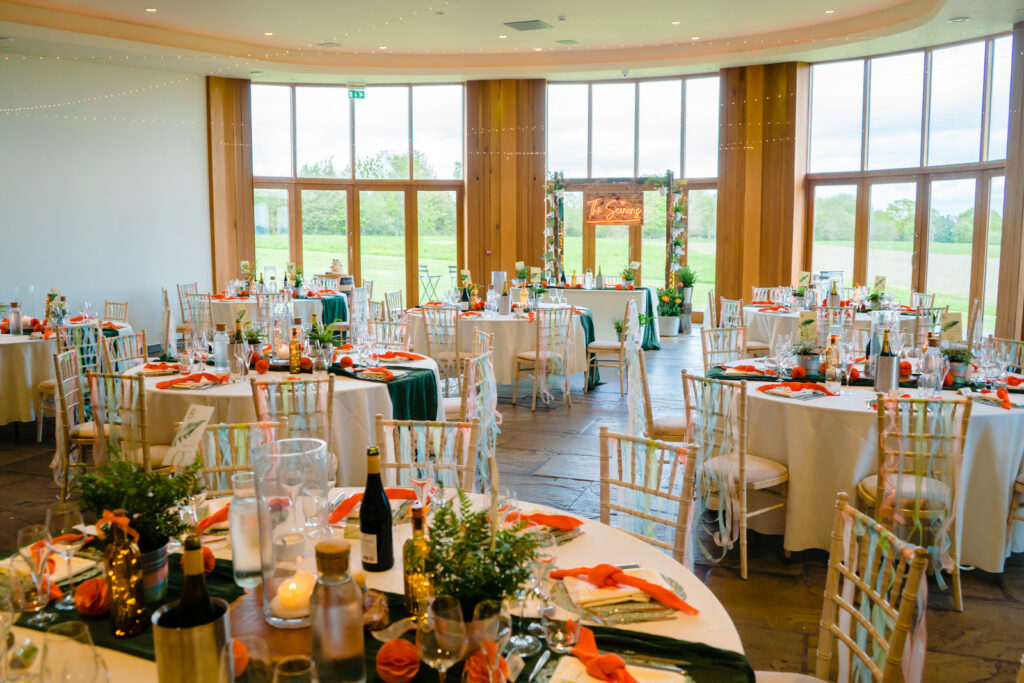 Elegant wedding reception at The Out Barn with decorated tables.
