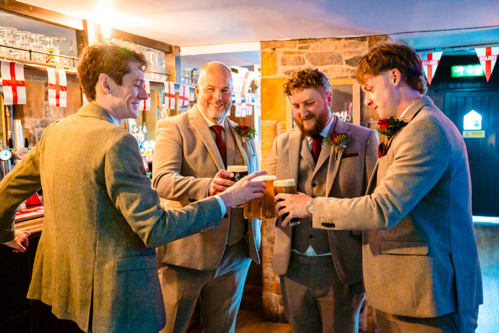 Groomsmen sharing a laugh during morning prep in Skipton