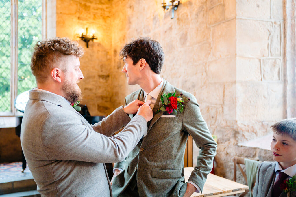 Groom adjusting his tie before the Priests House wedding ceremony