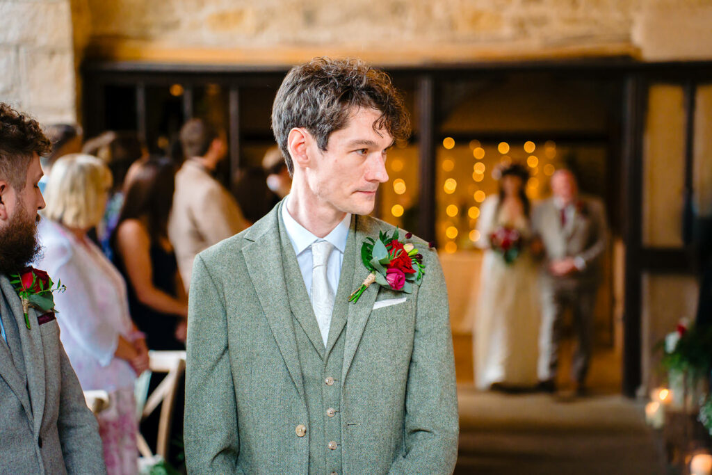 Emotional groom watching bride enter the Priests House ceremony room