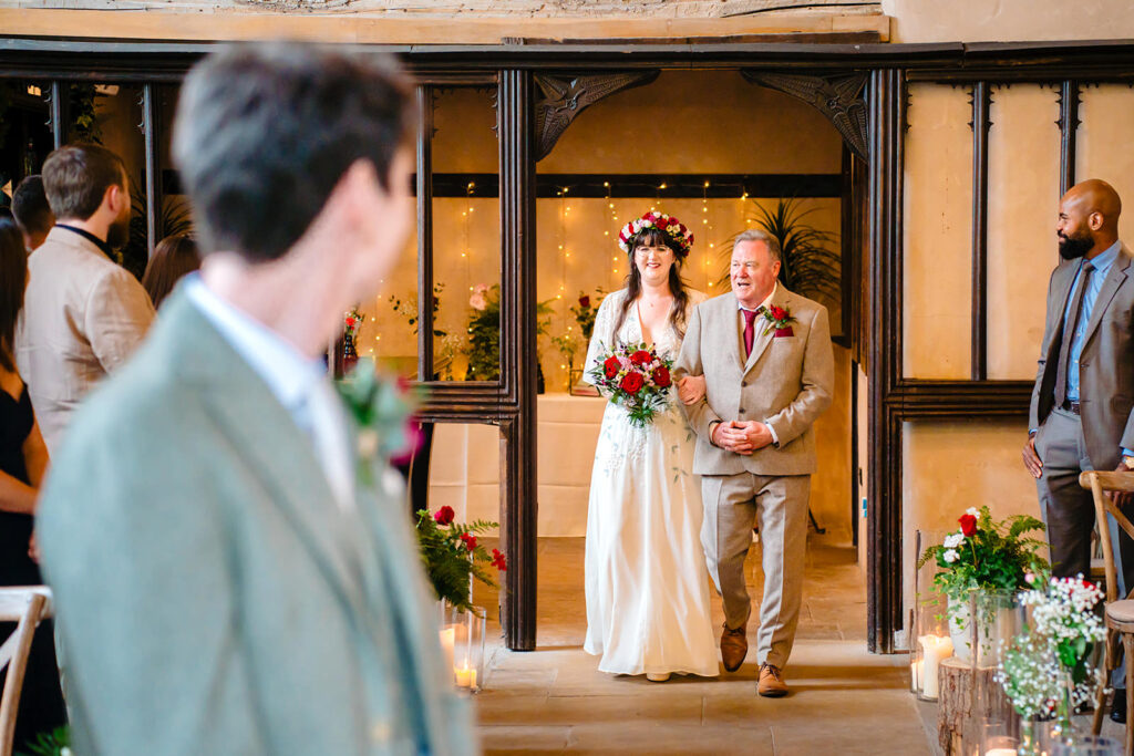 Bride walking down the aisle during the Priests House wedding ceremony