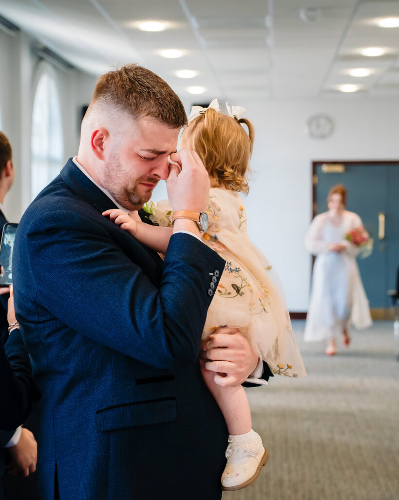 Wedding couple with photographers during coverage at Leeds Civic Hall